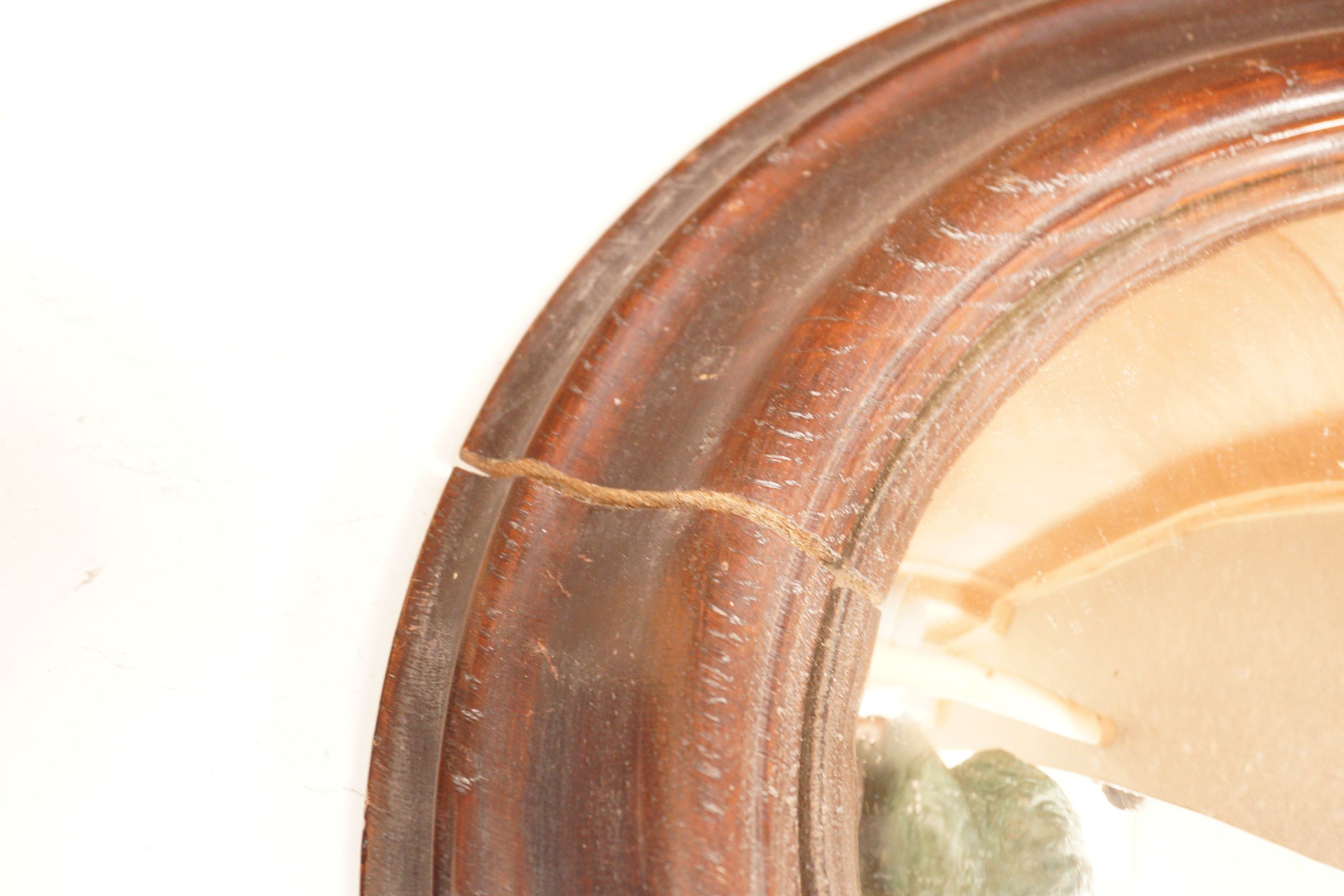 An unusual 19th century oval framed convex wall mirror, 44x54cm including frame